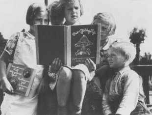 German children read an anti-Jewish propaganda book titled DER GIFTPILZ (